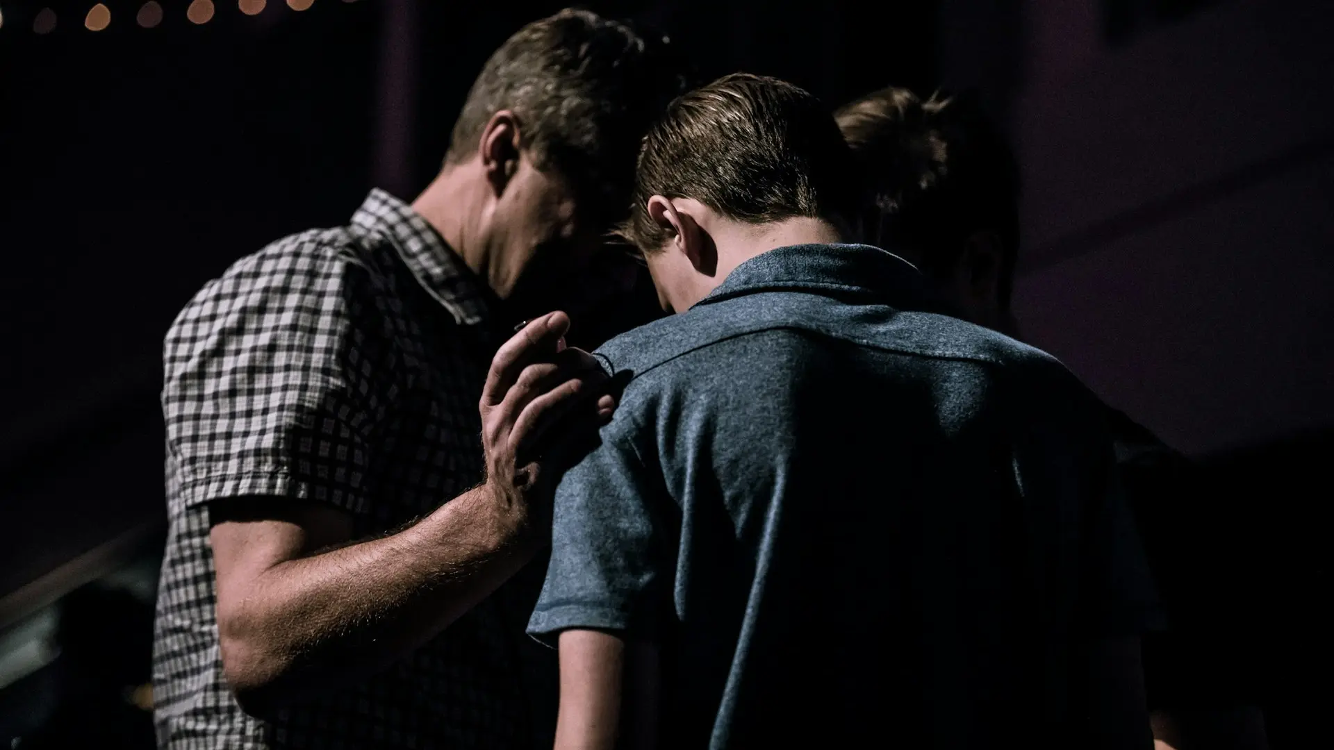men touching each other's foreheads
